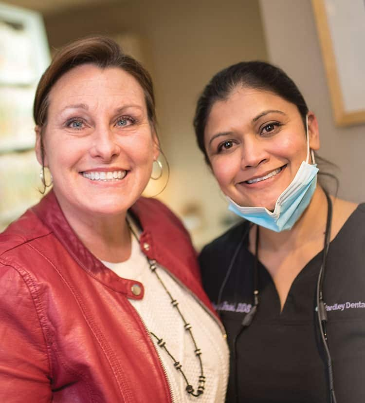 Dr. Purvi Patel and a patient smiling together.